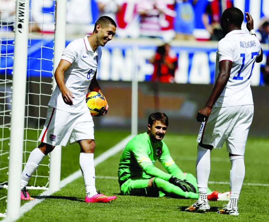United States' Clint Dempsey (left) celebrates with teammate Jozy Altidore (right) after scoring a goal onTurkey goalkeeper Onur Recep Kivrak (center) in the second half of an international soccer friendly in Harrison, NJ on Sunday. The US won 2-1.
