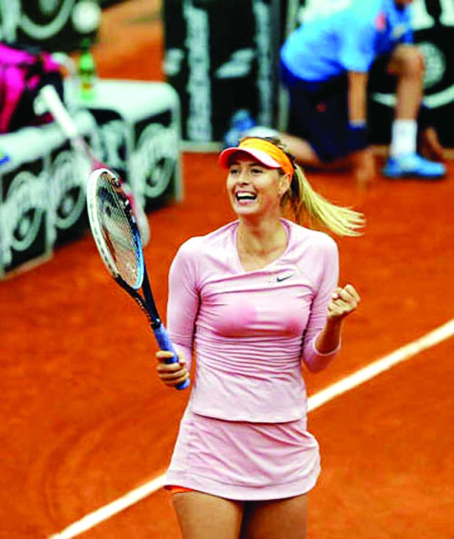 Russia's Maria Sharapova reacts as she defeats Australia's Samantha Stosur during their fourth round match of the French Open tennis tournament at the Roland Garros stadium in Paris, France on Sunday.