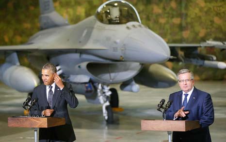 President Barack Obama and Poland's President Bronislaw Komorowski make statements and meet with US and Polish troops at an event featuring four F-16 fighter jets, two American and two Polish, as part of multinational military exercises, in Warsaw, Polan