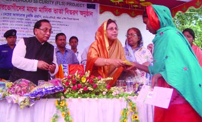 CHAPAINAWABGANJ: State Minister for Women and Children's Affairs Meher Afroj Chumki distributing monthly allowance among the beneficiaries under Food and Livelihood Security (FLS) Project in Chapainawabganj on Sunday.