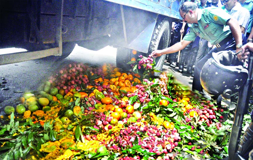 Formalin-mixed seasonal fruits including litchi, mango being destroyed by a DMP mobile team in city's Hatirpool area on Tuesday.