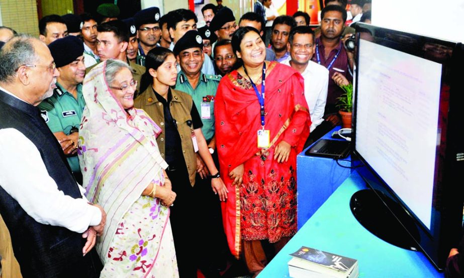 Prime Minister Sheikh Hasina visiting a stall of Digital World-2014 Fair after inaugurating it at Bangabandhu International Conference Center in the city on Wednesday.