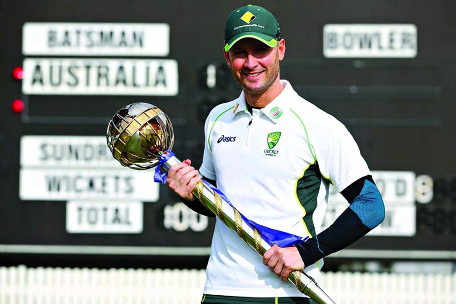 Michael Clarke with the ICC's Test mace at Brisbane on Tuesday.