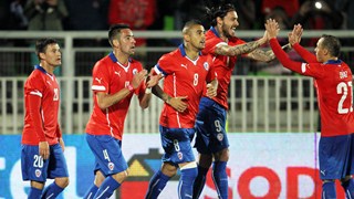 Chilean soccer players celebrate after scoring a goal to North Ireland during their friendly soccer game ahead of the 2014 FIFA World Cup in Brazil, at the Elias Figueroa stadium in Valparaiso, Chile on Wednesday.
