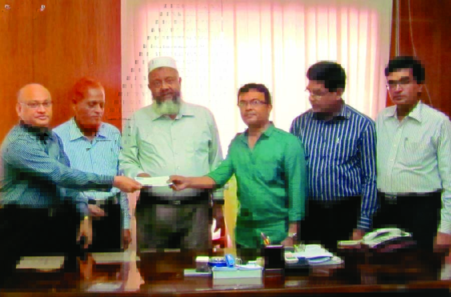 Abul Kalam Azad, Sr Additional Managing Director of Crystal Insurance Company Limited handing over a cheque of Tk20,00,000 to Shamsul Alam Tuhin, General Manager of Himalay Paper and Board Mills Limited as Fire Insurance Settlement Claims recently.