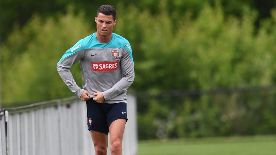 Portugal's Cristiano Ronaldo pulls up his shorts as he jogs during training June 4, 2014 in Florham Park, New Jersey. Portugal made a stop in the US for training and warm up games on their way to Brazil for the World Cup.