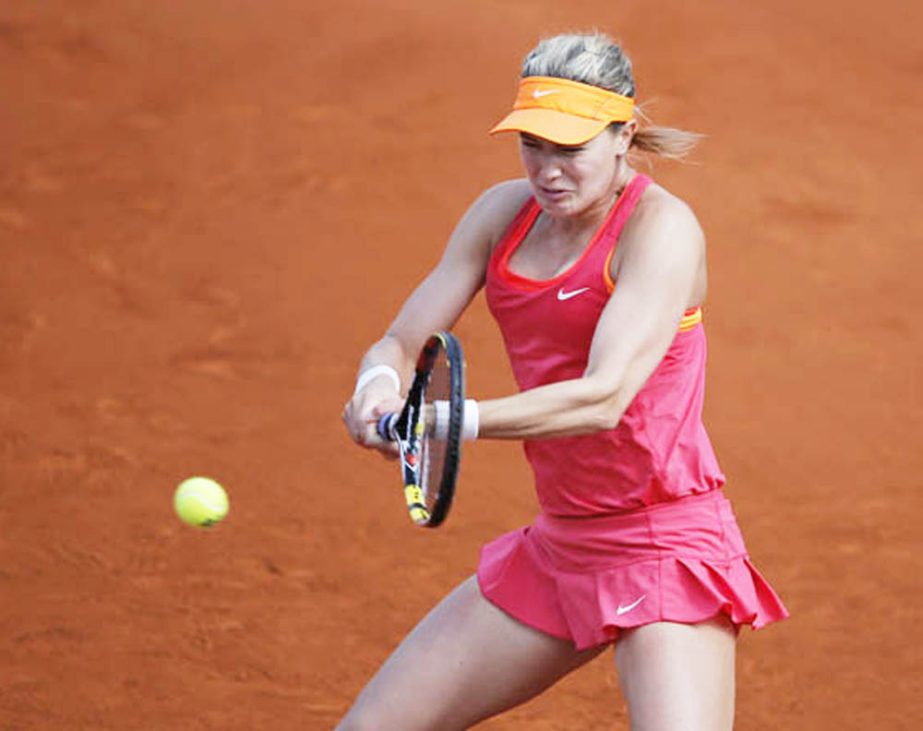 Canada's Eugenie Bouchard returns the ball during the semifinal match of the French Open tennis tournament against Russia's Maria Sharapova at the Roland Garros stadium in Paris, France on Thursday. Sharapova won in three sets 4-6, 7-5, 6-2.