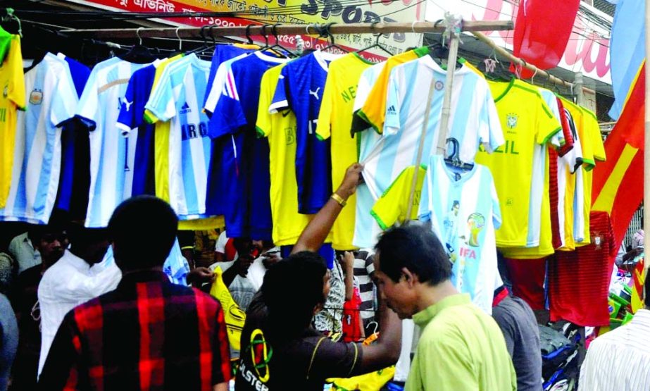 Jerseys of participating countries of FIFA World Cup 2014 being sold in cityâ€™s sports goods shop. This picture was taken on Friday.