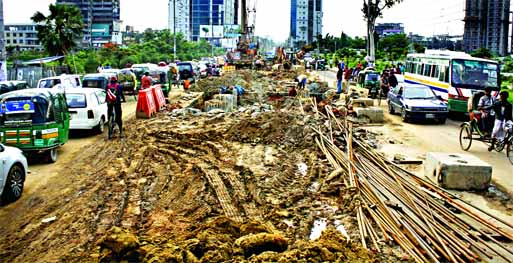 The construction work on Moghbazar-Tejgaon Fly-over has virtually been abandoned due to fund crunch. The contractors engaged for the work even don't bother to keep the busy road fit to traffic from any direction. This photo was taken from cityâ€™s S