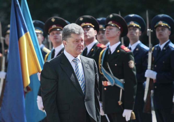 Ukrainian President Petro Poroshenko reviews an honor guard after the inauguration ceremony in Sophia Square in Kiev, Ukraine on Saturday.
