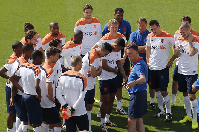 Netherlands soccer team coach Louis van Gaal (front right) briefs his team before a training session in Rio de Janeiro Brazil on Saturday. The Netherlands play in group B of the 2014 soccer World Cup.