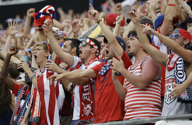 Fans cheer on the United States team during the second half of an international friendly soccer match between the United States and Nigeria in Jacksonville, Fla on Saturday. The United States won 2-1.