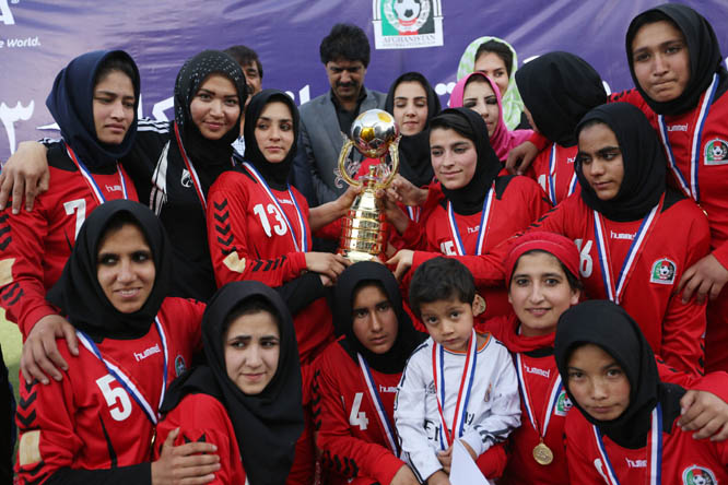 Members of the Afghan Club team pose for a photo after winning the final against the Maihan team in the Kabul Women's Premier League at the Football Federation Stadium in Kabul, Afghanistan on Saturday. In a nation where most women remain second-class ci
