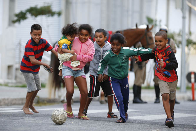 Children kick around a soccer ball outside the Independencia Stadium in Belo Horizonte, Brazil on Wednesday.