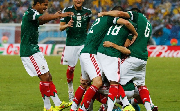 Mexico were rewarded for their attacking intent when Oribe Peralta's 61st minute strike gave them a 1-0 win over Cameroon in their World Cup opener at a rain-soaked Dunas arena on Friday.