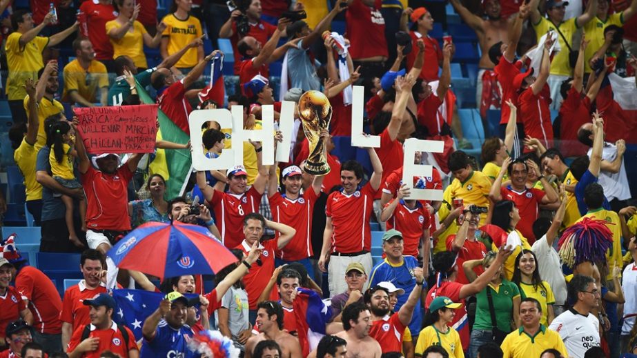 Chile fans celebrate after the win of 2014 FIFA World Cup Brazil Group B match between Chile and Australia at Arena Pantanal in Cuiaba, Brazil on Friday.