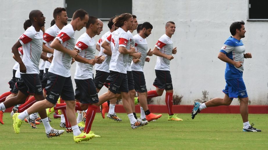 Switzerland's players run during a training session at the Municipal Stadium in Porto Seguro, during the 2014 FIFA World Cup in Brazil on Friday.