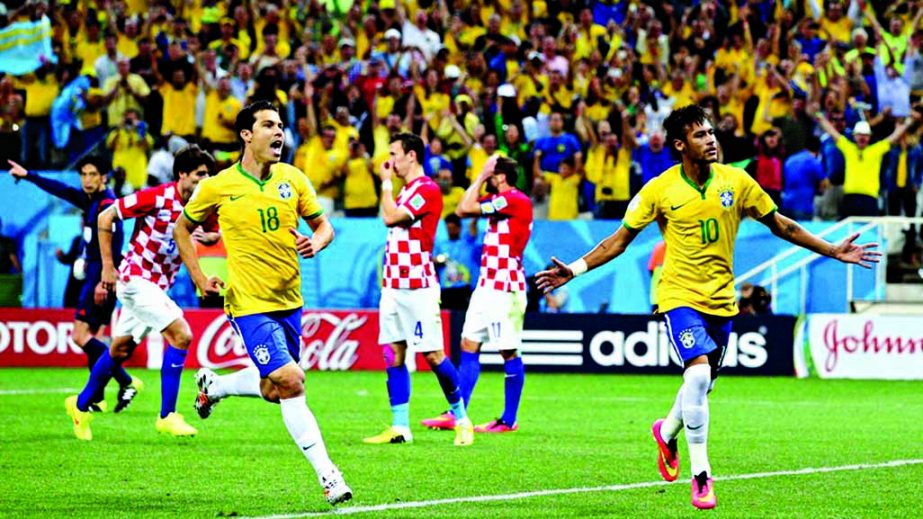 Neymar of Brazil (R) celebrates his second goal with Hernanes in the second half during the 2014 FIFA World Cup Brazil Group A match between Brazil and Croatia at Arena de Sao Paulo on Thursday night in Sao Paulo, Brazil.