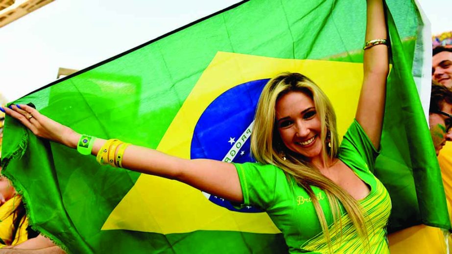 A fan waves a Brazilian flag during the 2014 FIFA World Cup Brazil Group A match between Brazil and Croatia at Arena de Sao Paulo on Thursday night in Sao Paulo, Brazil.