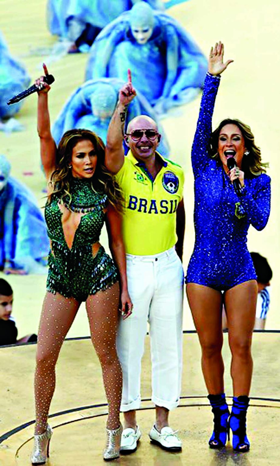 Performers are led by US singer Jennifer Lopez (L) US rapper Pitbull (C) and Brazilian pop singer Claudia Leitte (R) as they take part in the opening ceremony of the 2014 FIFA World Cup at the Corinthians Arena in Sao Paulo on Thursday night prior to the