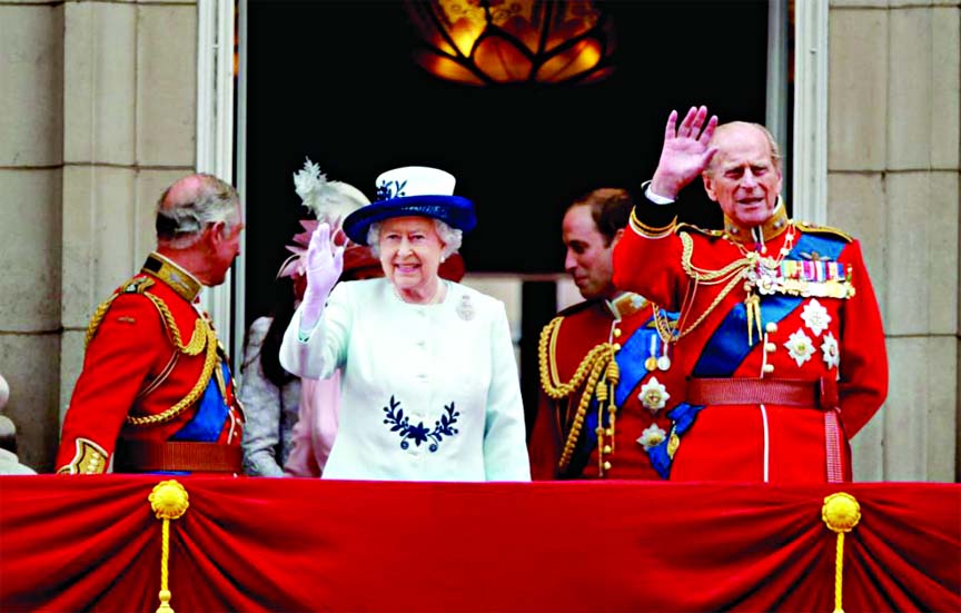 Royal wave: The Queen is joined by members of her family as she steps out on the balcony of Buckingham Palace following the Trooping the Colour parade to celebrate her official birthday.