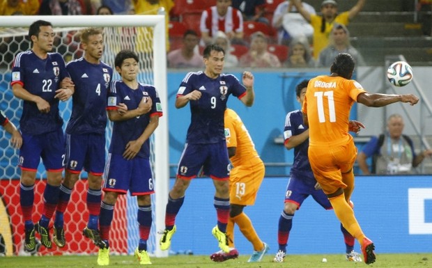 Ivory Coast's Didier Drogba (11) shoots a freekick during their 2014 World Cup Group C soccer match against Japan at the Pernambuco arena in Recife, June 14, 2014. Credit: Reuters