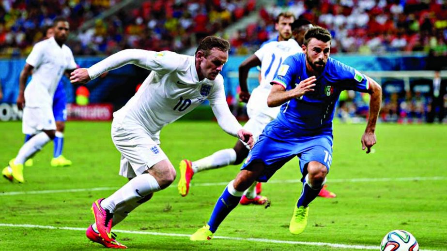 Wayne Rooney of England (10)controls the ball against Andrea Barzagli of Italy during the 2014 FIFA World Cup Brazil Group D match between England and Italy at Arena Amazonia in Manaus, Brazil on Saturday.