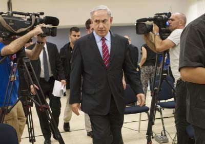 Israeli Prime Minister Benjamin Netanyahu leaves a press conference in Tel Aviv, Israel on Sunday.