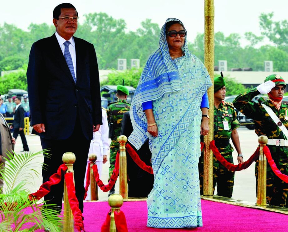 Visiting Cambodian Prime Minister Hun Sen being presented guard of honour at Hazrat Shahjalal International Airport on Monday. Prime Minister Sheikh Hasina was present on the occasion. BSS photo
