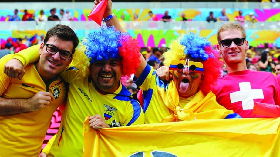 Brazil, Ecuador and Switzerland fans pose together during the 2014 FIFA World Cup Brazil Group E match between Switzerland and Ecuador at Estadio Nacional on Sunday 2014 in Brasilia, Brazil.
