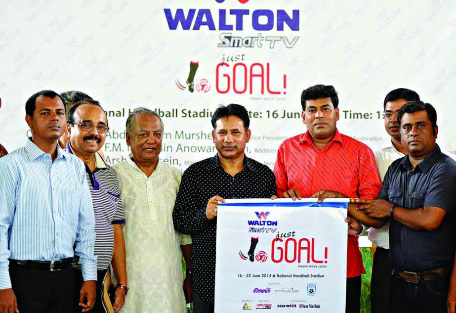 Senior Vice-President of Bangladesh Football Federation Abdus Salam Murshedy inaugurating the Walton Smart TV Just Goal Tournament as the chief guest at the Shaheed (Captain) M Mansoor Ali National Handball Stadium on Monday.