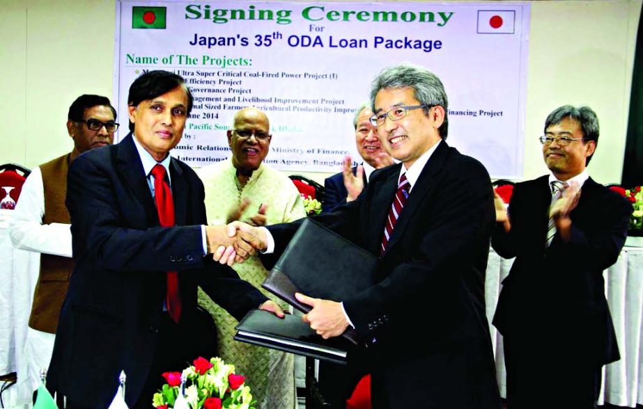 Economic Relations Division's Secretary Mohammad Mejbahuddin and JICA President Mikio Hataeda shaking hands after signing a loan agreement between the Bangladesh Government and JICA held at Pan Pacific Sonargaon Hotel in the capital on Monday. Finance Mi