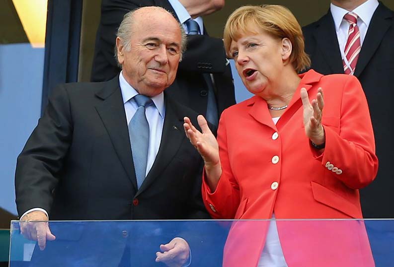 FIFA President Joseph Blatter and German Chancellor Angela Merkel look on during the 2014 FIFA World Cup Brazil Group G match between Germany and Portugal at Arena Fonte Nova on Monday in Salvador, Brazil.