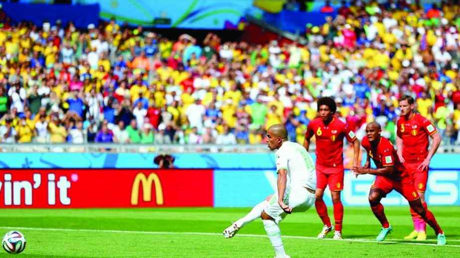 Sofiane Feghouli of Algeria scores his team's first goal on a penalty kick during the 2014 FIFA World Cup Brazil Group H match between Belgium and Algeria at Estadio Mineirao in Belo Horizonte, Brazil on Tuesday. Algeria was leading by 1-0 in first half