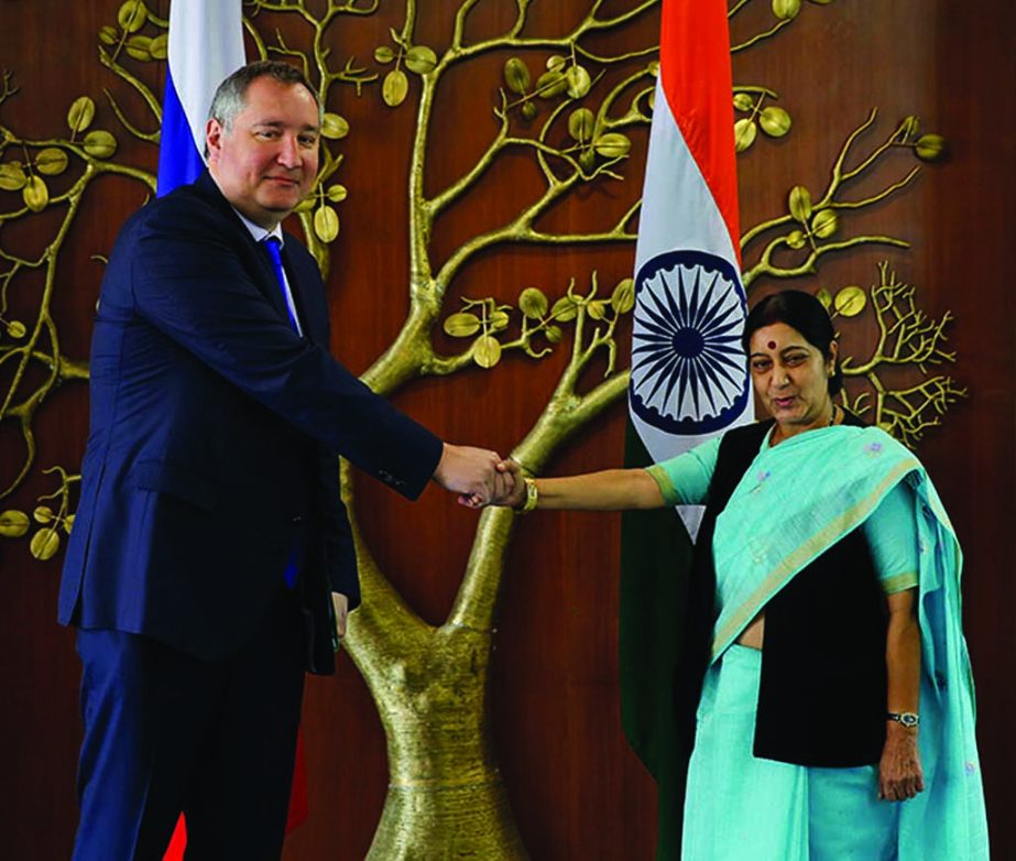 Russian Deputy Prime Minister Dmitry Rogozin and Indian Foreign Minister Sushma Swaraj, pose for the media before their meeting in New Delhi.