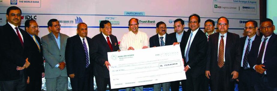 Bangladesh Bank Governor Dr Atiur Rahman presiding over the "Signing & Cheque Handover Ceremony"" of syndicated term loan of Tk 1980.00 million for KDS Logistics Limited at a city hotel on Tuesday. Dhaka Bank Limited is the lead arranger and agent bank."