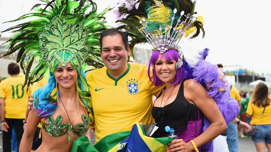 Brazil fans pose before the 2014 FIFA World Cup Brazil Group A match between Brazil and Mexico at Castelao on Tuesday in Fortaleza, Brazil.