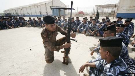 Volunteers are trained by Iraqi security forces in Karbala on Thursdayt Members of Iraq's Shia majority community have signed up as volunteers with the security forces