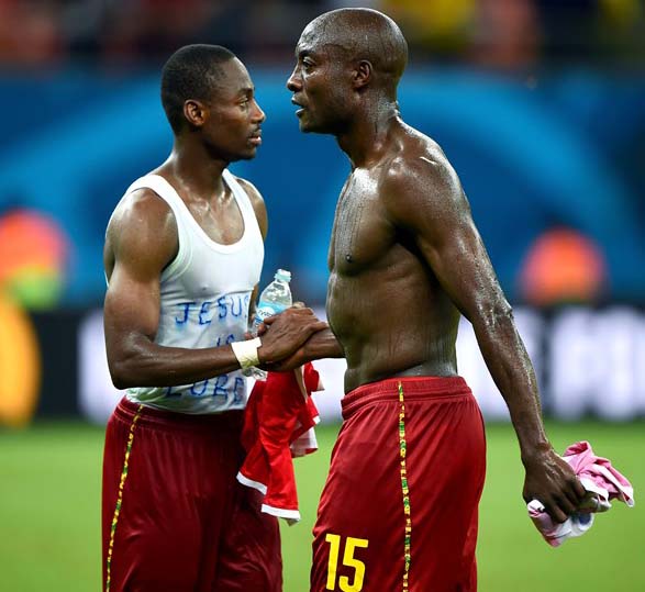 Dany Nounkeu (R) and Enoh Eyong of Cameroon shake hands after the 2014 FIFA World Cup Brazil Group A match between Cameroon and Croatia at Arena Amazonia on Wednesday in Manaus, Brazil.