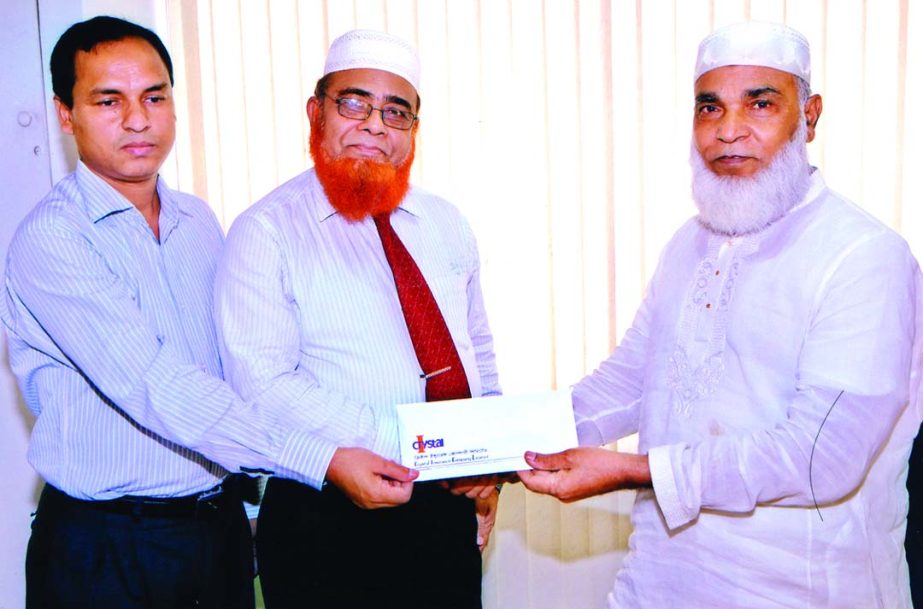 MA Latif Miah, Managing Director of Crystal Insurance Company Limited handing over an insurance claim cheque to Khandaker AHM Abdullah, Director of Health Care Distribution Company recently.