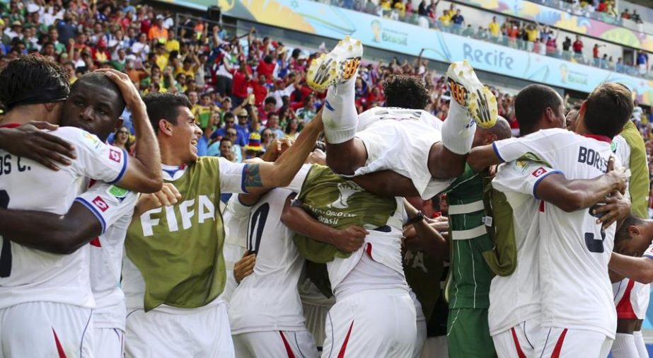 Wild celebration: Costa Rican players celebrate after Bryan Ruiz scored the game's only goal on Friday.