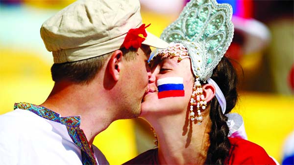 Russia fans kiss prior to the 2014 FIFA World Cup Brazil Group H match between Belgium and Russia at Maracana in Rio de Janeiro, Brazil on Sunday.