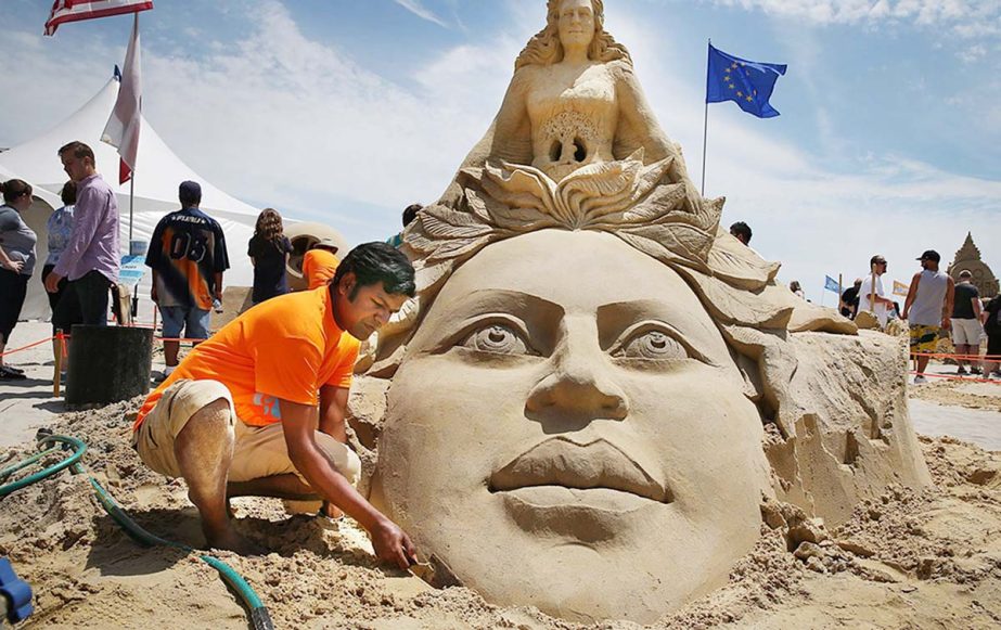 Sculptor Sudarsan Pattnaik, of India, works on his sculpture during the final day of the DO AC Sand Sculpting World Cup competition on the beach at Pennsylvania Avenue in Atlantic City, N.J.