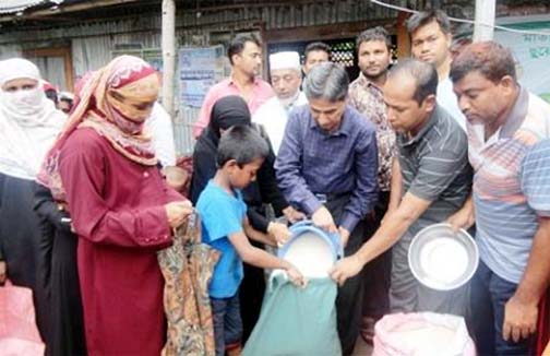 On behalf of Maria Rashidia Foundation , a charitable organization of Well Group owned by Chairman of Chittagong Development Authority Abdus Salam distributed relief goods among 300 families affected by recent water-logging at Katgar Bazar and Sailo G