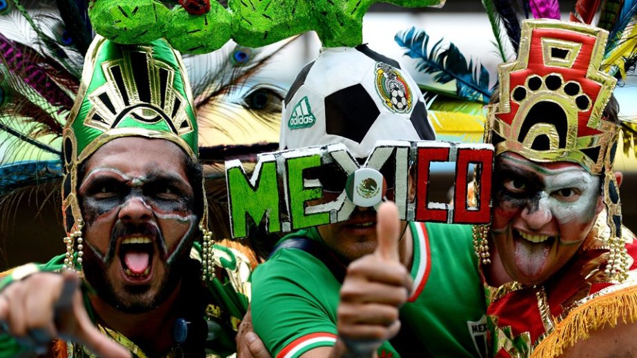 Mexico fans pose prior to the 2014 FIFA World Cup Brazil Group A match between Croatia and Mexico at Arena Pernambuco in Recife, Brazil on Monday.