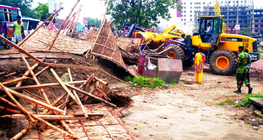 The illegal structures around the Hatirjheel Project were demolished by Rajuk to build a security boundary on Tuesday.