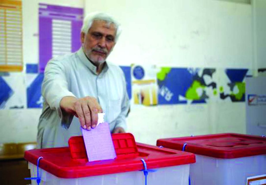 A man casts his vote at a polling station during a parliamentary election in Benghazi on Wednesday.