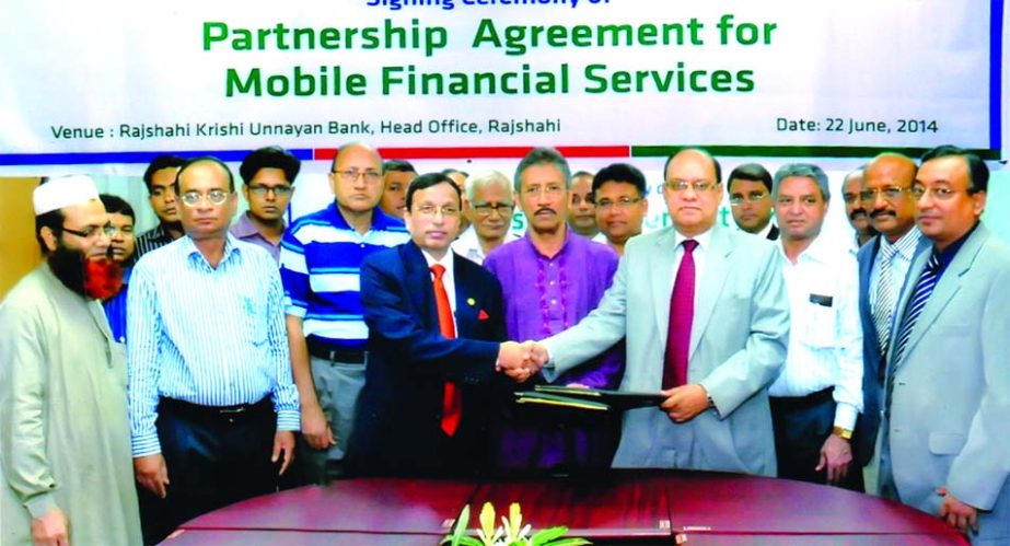 Md Mofazzal Husain, Managing Director of Rajshahi Krishi Unnayan Bank and KS Tabriz, Managing Director of Dutch-Bangla Bank sign a partnership deal for Mobile Banking Service at RAKUB head office recently.