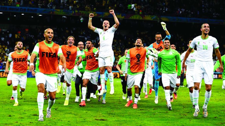 Algeria celebrate after a 1-1 draw during the 2014 FIFA World Cup Brazil Group H match between Algeria and Russia at Arena da Baixada in Curitiba, Brazil on Thursday.