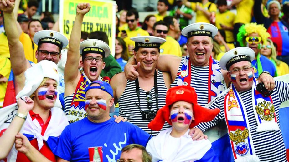 Russia fans cheer during the 2014 FIFA World Cup Brazil Group H match between Algeria and Russia at Arena da Baixada in Curitiba, Brazil on Thursday.